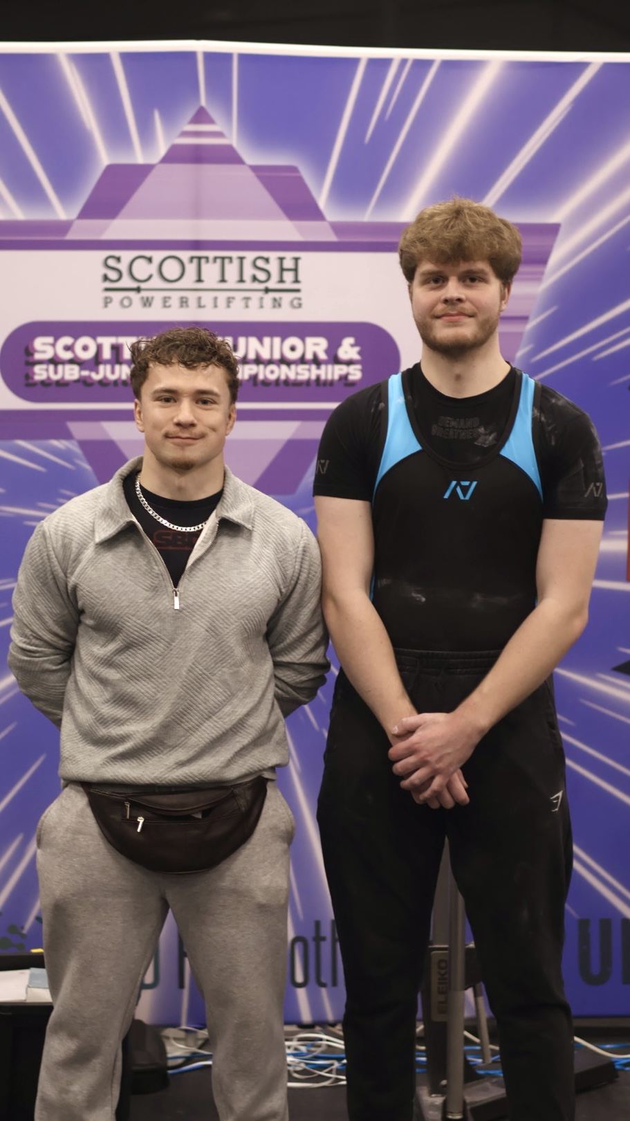 Coach with a lifter at the Scottish Junior and Sub-Junior Championships